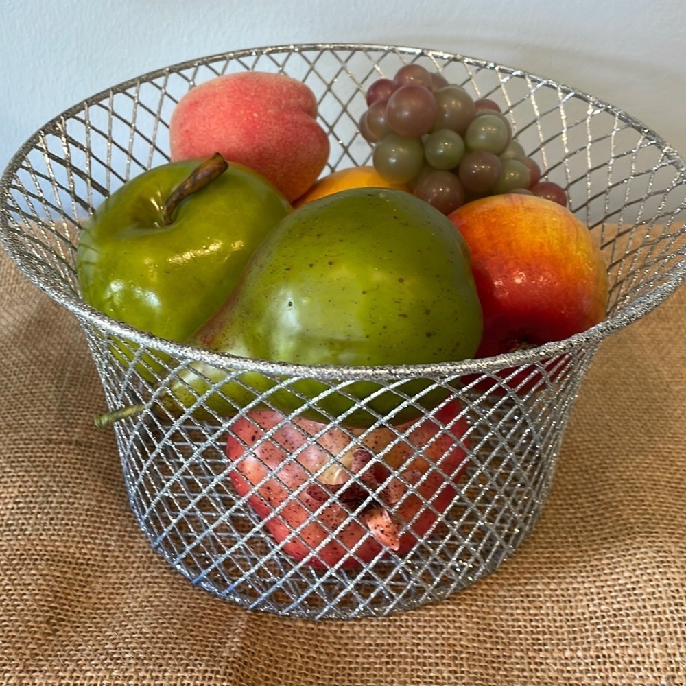 Silver sparkly wire basket full of decorative fruit